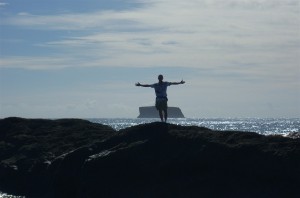 Man on a rock in the ocean